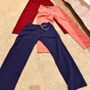 Figs Women's size small petite basic scrub pants - Maroon, Pink, and Navy.